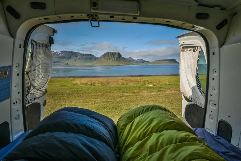 Breathtaking nature view from camper van by a lake in Iceland