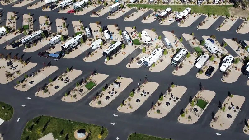 Aerial shot of RV park showcasing organized lots and modern amenities under bright daylight